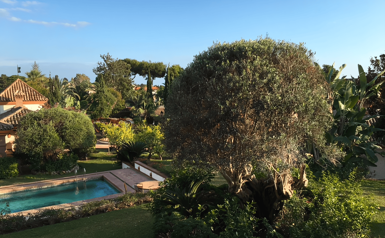 Custom-designed pool area at Costa Bella villa with water features and seating alcoves.